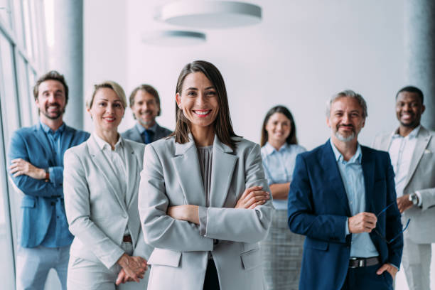 istock Confident businesswoman and her team. 2163365430