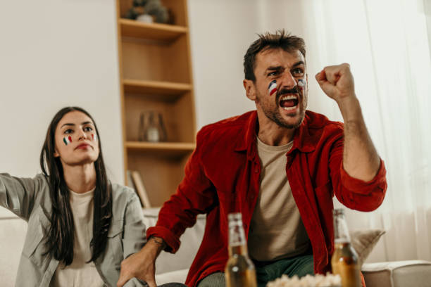 istock Diverse couple watching a sport 2163365646
