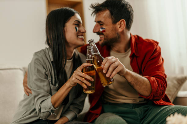 istock Diverse couple watching a sport 2163365740