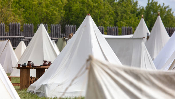 istock White medieval tents in nature in summer 2163368093
