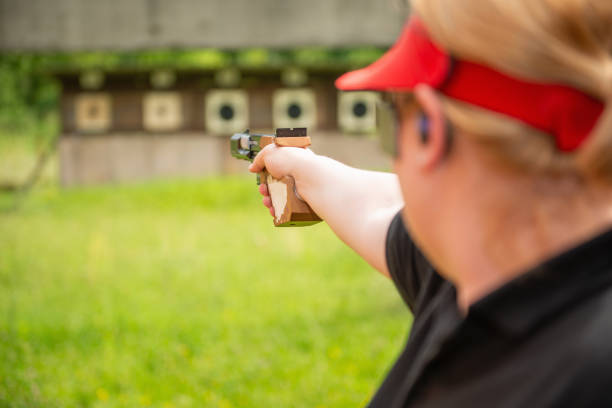 istock A dedicated female athlete, renowned for her precision and discipline, practices during a sports shooting training session, preparing meticulously for an upcoming competition. 2163369351
