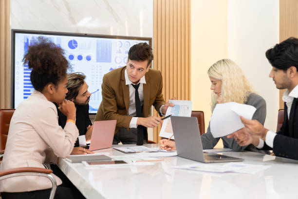 istock Professional smart business team discussion about start up project. Ornamented. 2163370598