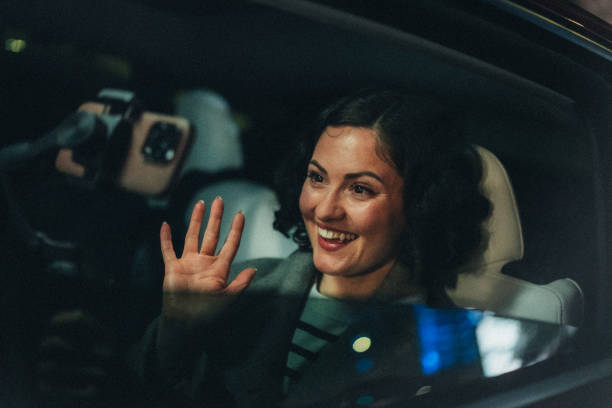 istock Smiling vlogger recording a video in car 2163374751