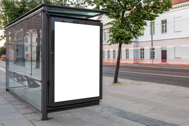 istock Blank White Bus Stop Vertical Poster Billboard Mockup On An Empty City Street 2163377368