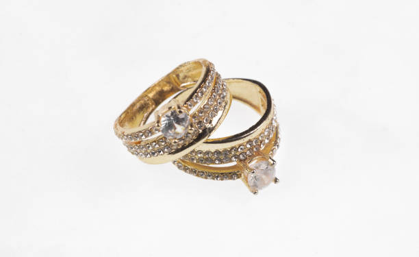 istock gold wedding rings with diamond isolated on white background 2163378610
