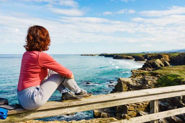 istock Woman visiting Cathedral Beach in Spain. 2163379489