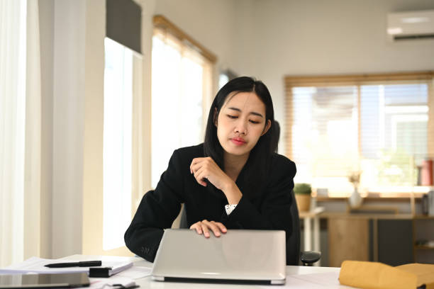 istock Young entrepreneur using laptop computer at her workplace. Businessman and technology concept 2163381597