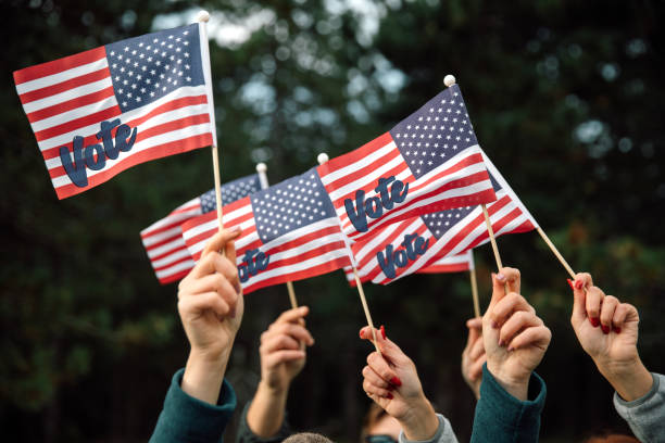 People waving presidential election US Flags