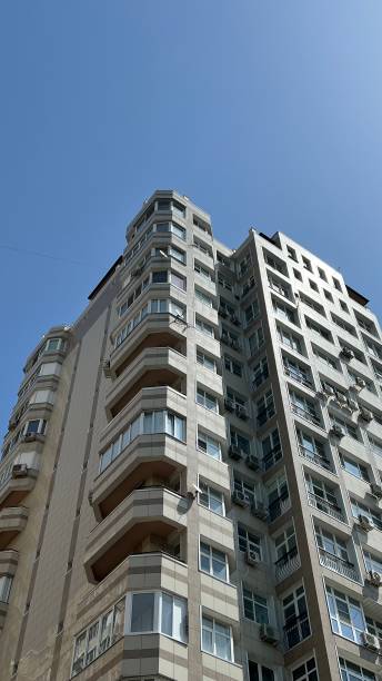 istock multi-storey building view from below. urban architecture 2163387083