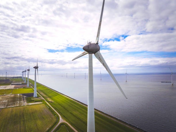 istock Wind turbines on a lakeshore 2163388541