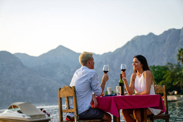 istock Couple is having a private event dinner on a tropical beach during sunset time 2163389122
