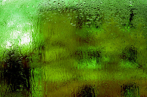 wet glass. green textured background