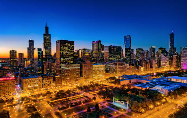 Chicago Skyline Illuminated Aerial At Dusk With Grant Park