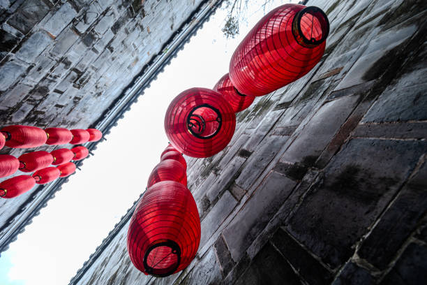 Red Lanterns Hanging on Brick Wall in China
