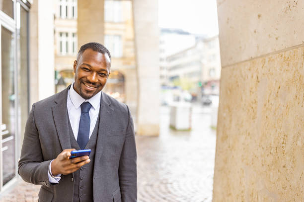 istock Professional Businessman Smiling in Urban Morning Setting 2163394688