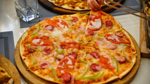 istock Pepperoni and Green Pepper Pizza Slice 2163394901