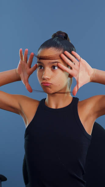 istock Young girl playfully stretches a hairnet over her face, making a funny expression while sitting in a chair. 2163395574