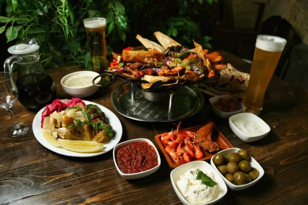 istock Dinner Table With Grilled Meats, Seafood, and Sides 2163395624