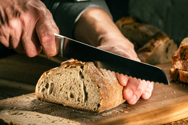 istock Homemade Bread Slicing in Kitchen 2163396909