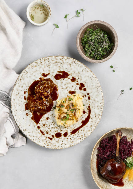 istock Delicious Beef Cheeks and Creamy Mashed Potatoes with Demi-Glace Sauce on Rustic Plate 2163405570