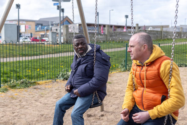 istock Sharing Stories On The Swings 2163408119