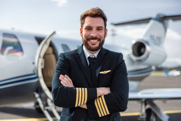 istock Confident Male Pilot with Private Jet 2163408172