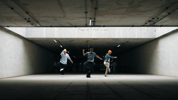 istock Long shot of hipster group dance together while perform b-boy dance. Sprightly. 2163412190