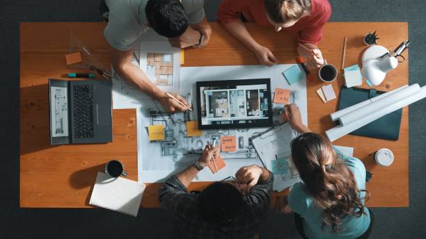 istock Top view of civil engineer using tablet to design house structure. Symposium. 2163412765