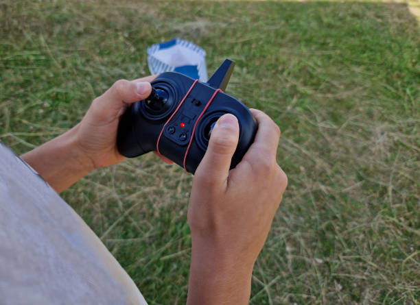 istock RC remote controlscontroller with joysticks and buttons to control the movement of the drone, its speed height. It is also equipped with a smartphone antenna so that it is possible to watch footage 2163415085