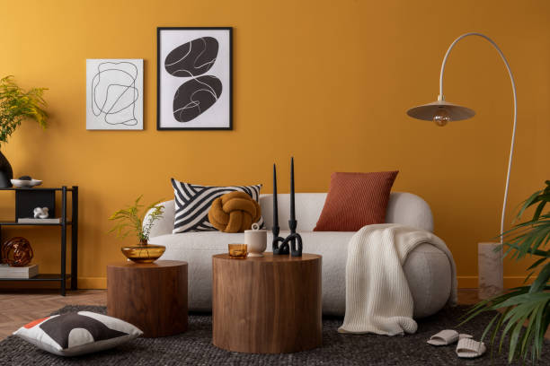 istock Creative composition of living room interior with mock up poster frame, boucle sofa, marble lamp, wooden coffee table, patterned pillows, black rack and personal accessories. Home decor. Template. 2163417696