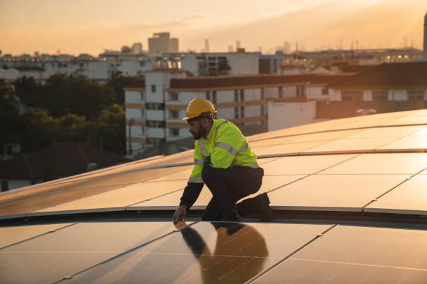istock Service engineer checking solar cell on the roof for maintenance if there is a damaged part. Engineer worker install solar panel. Clean energy concept. 2163419127