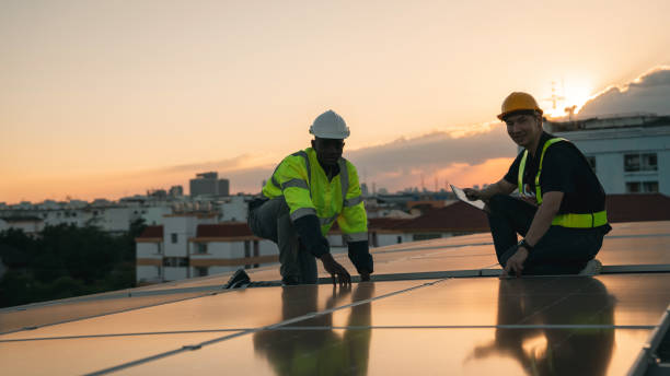 istock Service engineer checking solar cell on the roof for maintenance if there is a damaged part. Engineer worker install solar panel. Clean energy concept. 2163419152