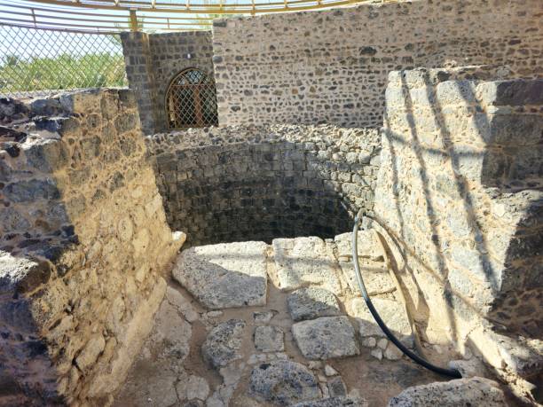 istock Al Ghars well, a historical site linked to prophet Muhammed peace be upon him, lined with basalt stones, surrounded by building foundations, near Quba mosque 2163419196