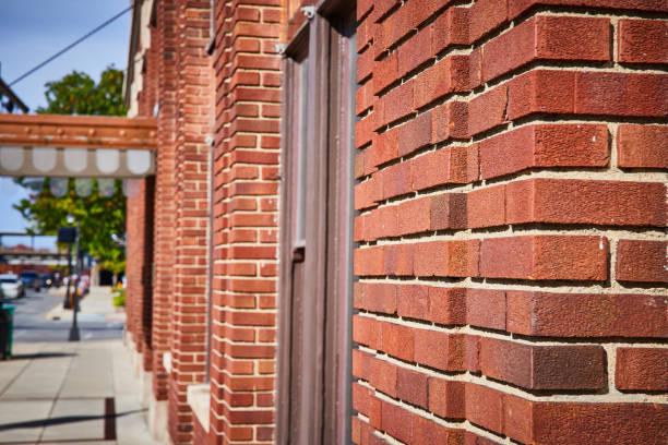 istock Red Brick Wall Texture and Urban Street Bokeh 2163424646