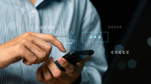 istock Male hands using smartphone to type live chat talking on digital web and social network concept. Social media application chat box. Social media marketing technology concept. 2163424698
