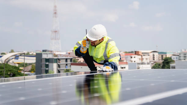 istock Service engineer checking solar cell on the roof for maintenance if there is a damaged part. Engineer worker install solar panel. Clean energy concept. 2163428423
