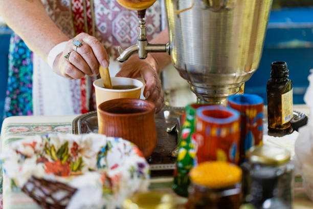 istock Copper samovar with white teapots and cup of herbal tea 2163430465
