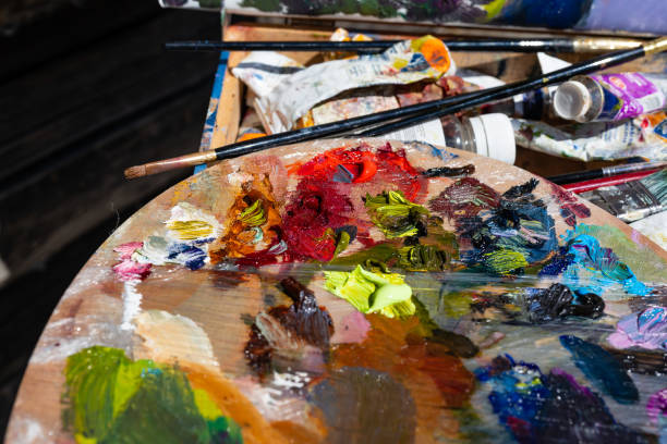 istock Artist's palette, close-up. Selective focus on the foreground. Background image 2163430532