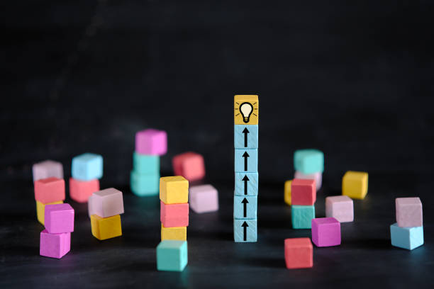 istock Business concept,collaboration,cooperation,teamwork makes the dream work, innovation,human resources,recruitment,team building, arrows and lightbulb symbols 2163432197