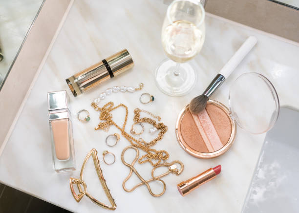 istock Gold jewellery and make up products  on a marble surface 2163432205