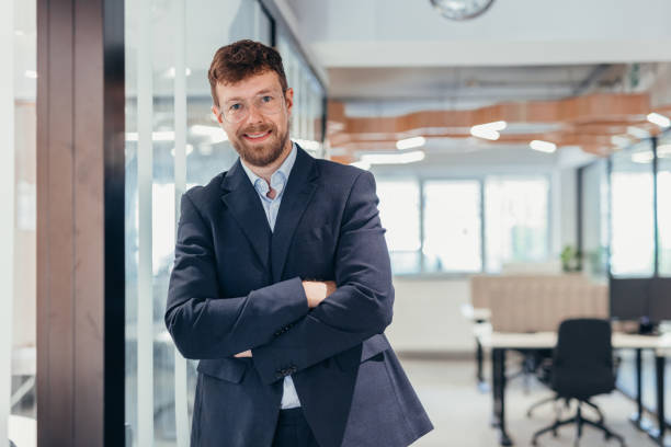 istock Successful businessman looking at camera with confidence 2163436761