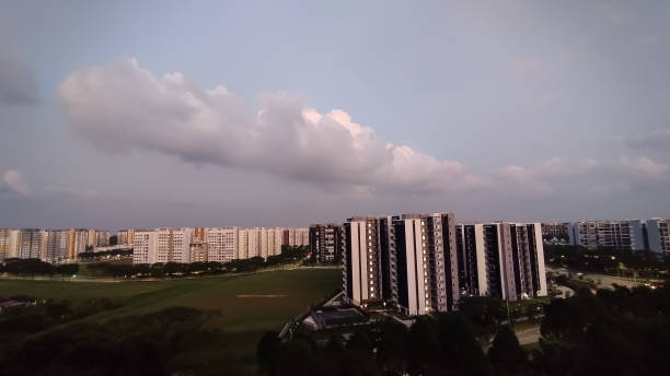 istock cloudy blue sky at dusk in a residential area 2163440009