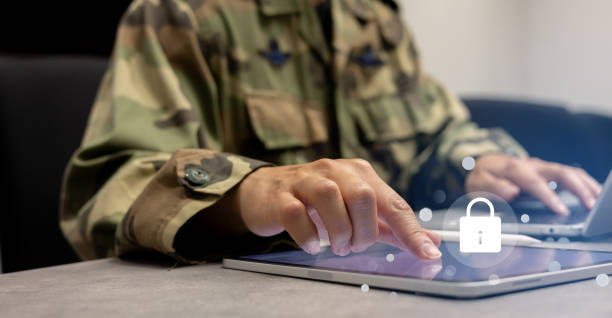 istock close up soldier man hand tap on digital tablet screen to check security system of access data in private monitoring room with virtual icon for military operation control and command concept 2163441722