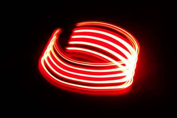 istock Blurred red neon lights.  Overlay of colored light.  Disco lighting.  Soft texture of unfocused red ultraviolet light on dark abstract empty space background 2163444556