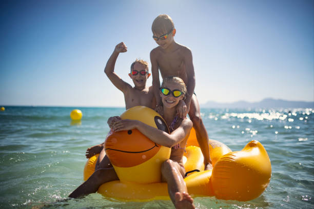 istock Kids enjoying summer beach vacation at sea. 2163444812