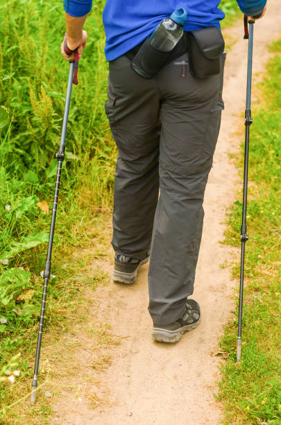 istock A man with Scandinavian sticks in the forest. Active lifestyle. Walking. 2163452458
