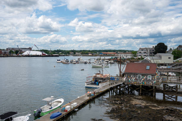 Piscataqua river from Memorial bridge in Portsmouth, New Hampshire, during summer day with boats and houses
