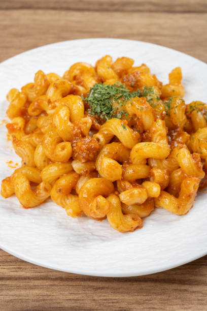 istock angle view dish of classic tomato bolognese pasta at vertical composition 2163454846