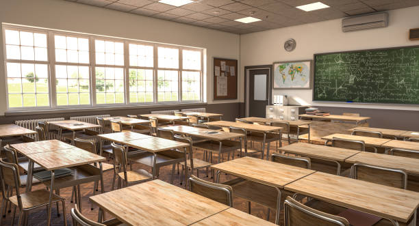 istock Empty classroom with the sunlight shining through the windows 2163459719