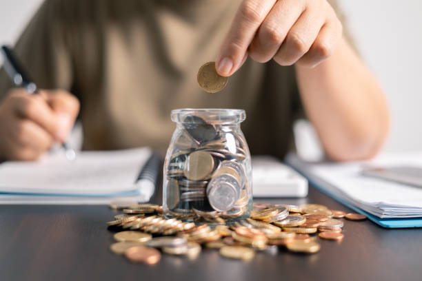 istock Proper management of finance involves balancing income and savings, strategically using coins and money for investments and loans, to optimize business budget and maximize earning potential. 2163463949